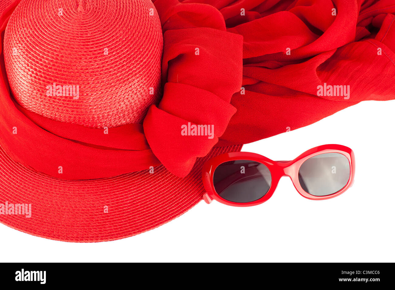 Woman`s summer red straw hat, modern sunglasses and scarf isolated on white background Stock Photo